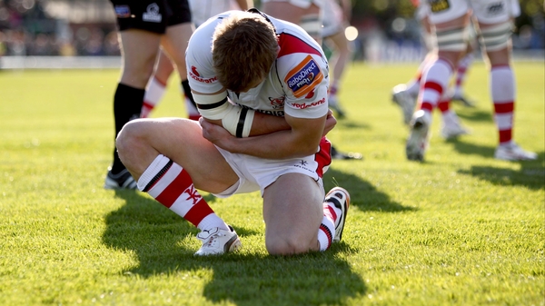 Paul Marshall grasps his elbow after injuring it while scoring a try against Connacht
