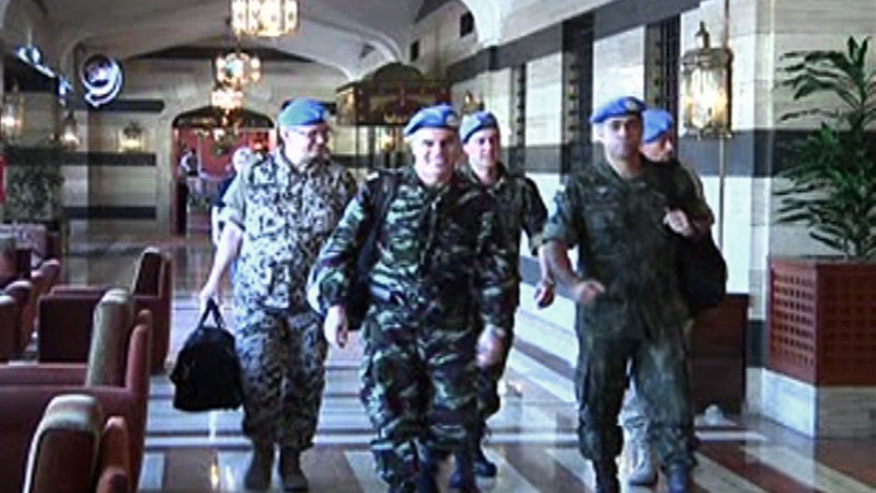 Members of an advance team of six UN observers