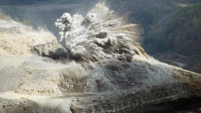 An explosive is detonated at an A & G Coal Corporation surface mining operation in the Appalachian Mountains, Virginia
