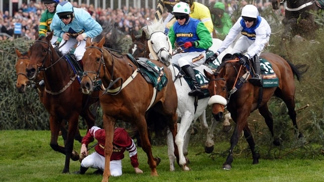 Jockey James Reveley (down) falls from Always Right during the Grand National horse race at Aintree