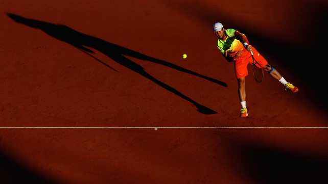 Fernando Verdasco of Spain serves in a doubles match during day four of a competition in Monte-Carlo, Monaco