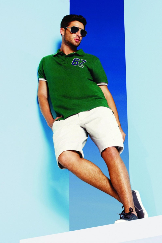 Green polo shirt €10, shorts €17, trainers €7 and sunglasses €3