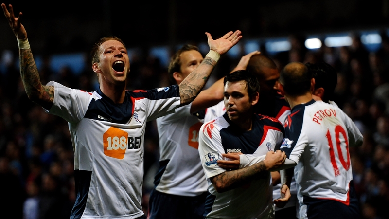 Bolton players celebrate David Ngog's strike at Villa Park