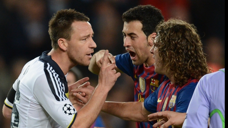 Chelsea captain John Terry argues with Sergio Busquets and Carlos Puyol after his sending off against Barcelona
