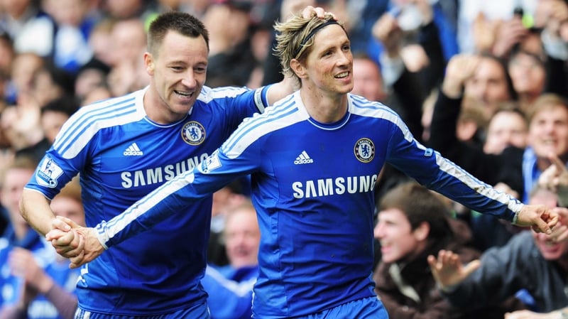 Fernando Torres is congratulated by his skipper, John Terry, as Chelsea romped past west London rivals QPR at Stamford Bridge