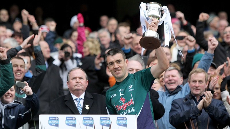 Kildare captain John Doyle lifts the Division Two trophy