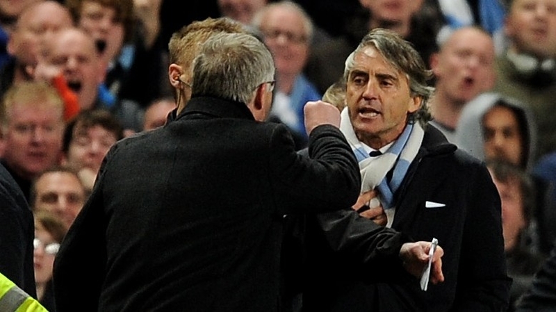 The rival managers exchange pleasantries at the Etihad