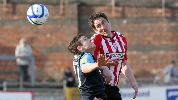 Ruairdhi Higgins of Derry and John Russell of St Pat's contest a high ball