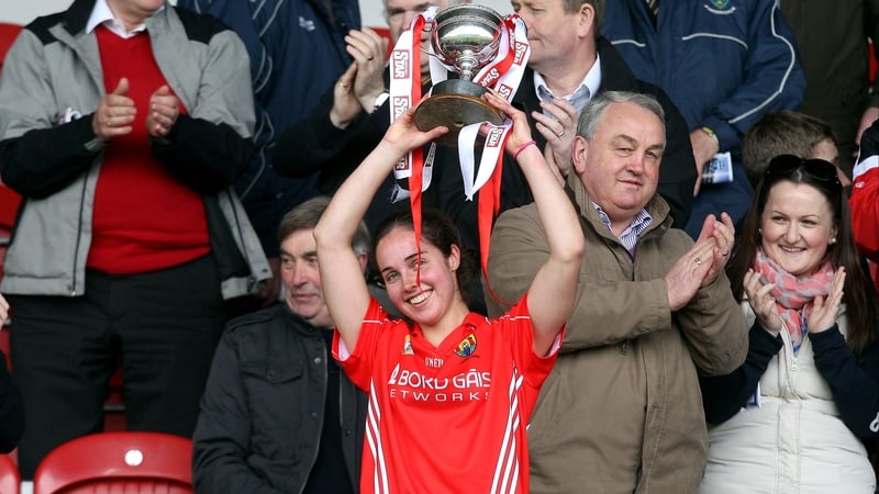 Cork captain Julia White lifts the Division 1 trophy after her side defeated Wexford by two points in the Semple Stadium decider