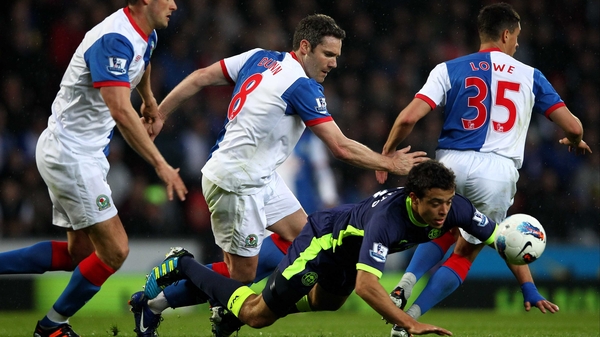 Wigan's Franco Di Santo takes a tumble under pressure from David Dunn