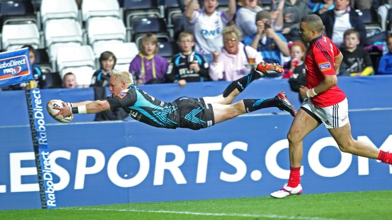 Ospreys' Hanno Dirksen dives over the whitewash to score his team's third try at the Liberty Stadium