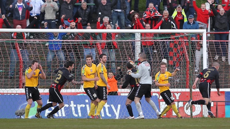 Crusaders' Colin Coates (6) turns to celebrate scoring his side's second goal