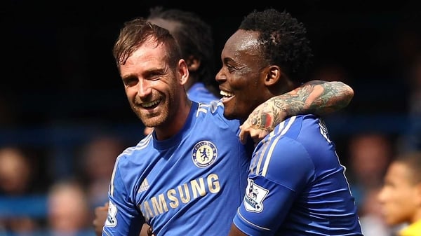 Michael Essien celebrates with goal scorer Raul Meireles