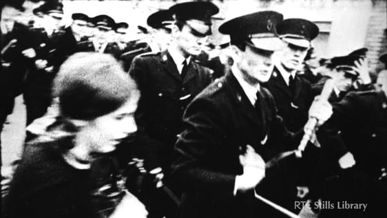 RUC men holding batons march along a Derry street during the riots.

© RTÉ Stills Library 0130/057