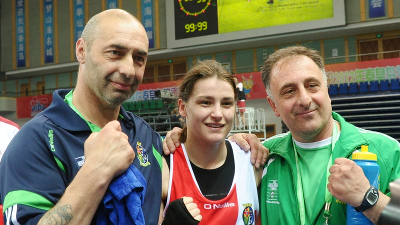 Katie Taylor celebrates with her father and coach Peter, and assistant coach Zaur Anita