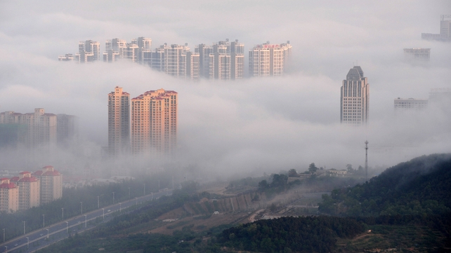 A view of the city of Yantai is seen in a blanket of fog in Shandong Province of China