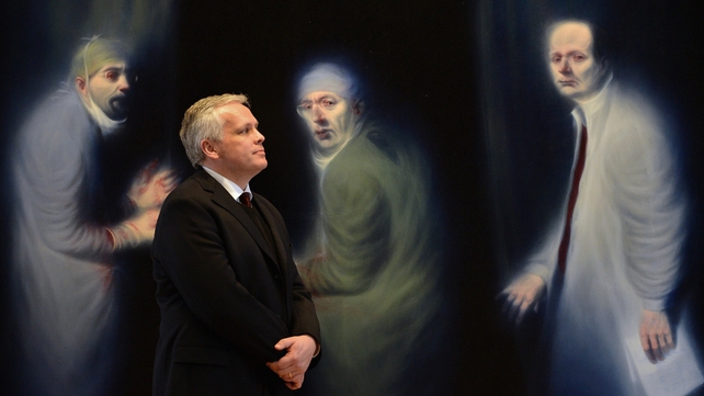 The incoming Director of the Scottish National Portrait Gallery in Edinburgh poses in front of the Three Oncologist by Ken Currie