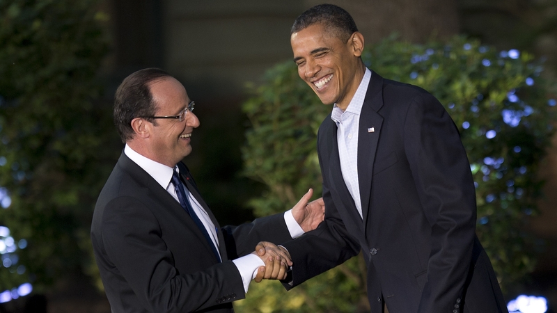 US President Barack Obama greets French President Francois Hollande upon his arrival at the Camp David