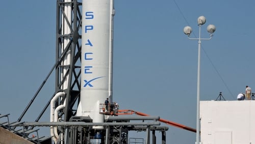 SpaceX's Falcon 9 spacecraft, with the Dragon reusable capsule, sits on the launch pad yesterday