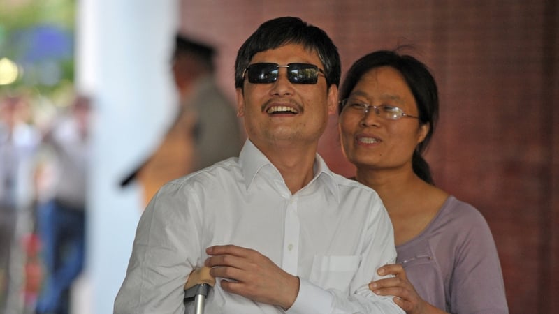 Chen Guangcheng and his wife Yuan Weijing arrive at the New York University Village apartment complex in Manhattan