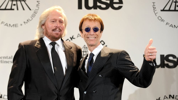 Barry Gibb (l) and brother Robin (r) of the Bee Gees attend the 25th Annual Rock And Roll Hall of Fame Induction Ceremony
