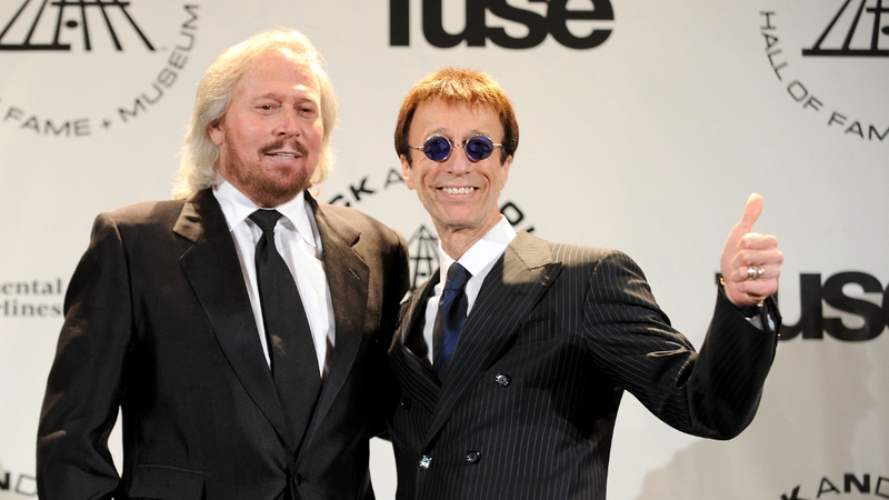 Barry Gibb (l) and brother Robin (r) of the Bee Gees attend the 25th Annual Rock And Roll Hall of Fame Induction Ceremony