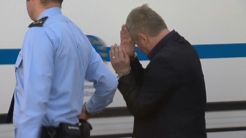 Sorin Dinu is led away from Trim Circuit Court today
