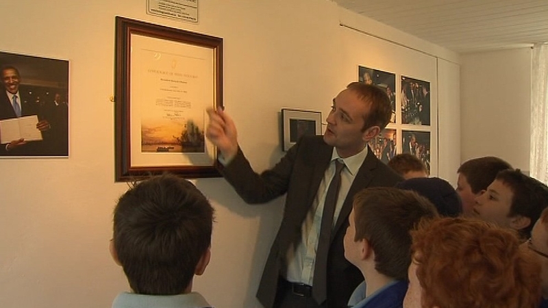 President Obama's distant cousin Henry Healy shows children around the visitor centre