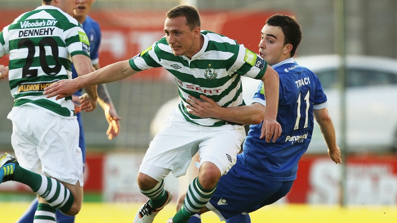 Gary O'Neill of Shamrock Rovers tries to get away from Limerick's Shane Tracy