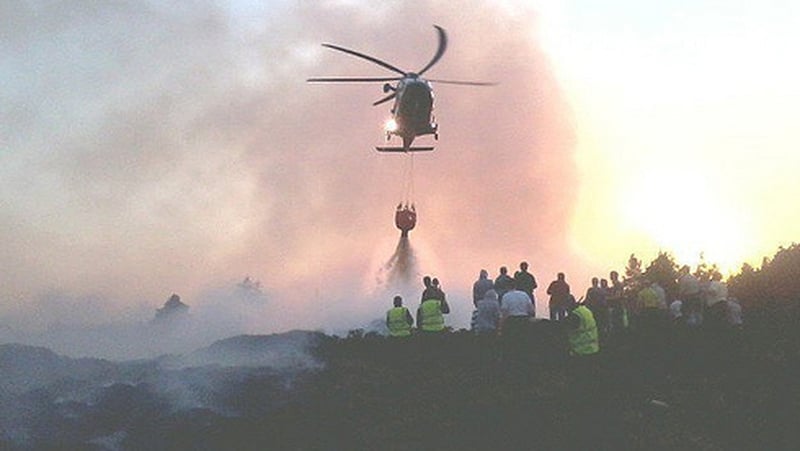 Bambi Bucket being used to disperse the fires