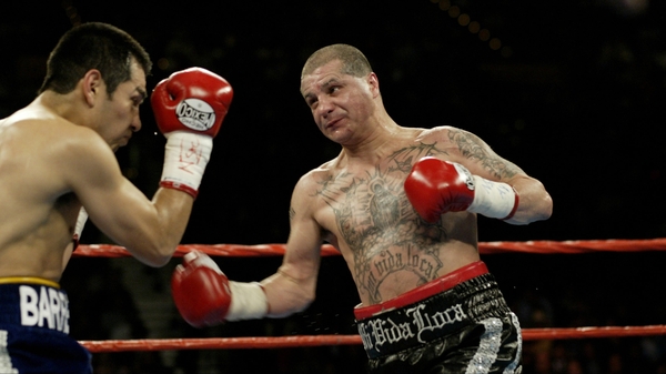 Former three-weight champion Johnny Tapia, seen here fighting Marco Antonio Barrera, was found dead in his New Mexico home
