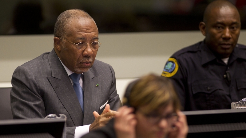 Charles Taylor sits in court during his trial
