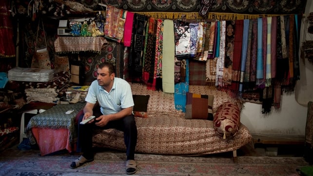 Carpet seller Tarig Agaew awaits the Eurovision Song Contest final at his shop in Baku, Azerbaijan