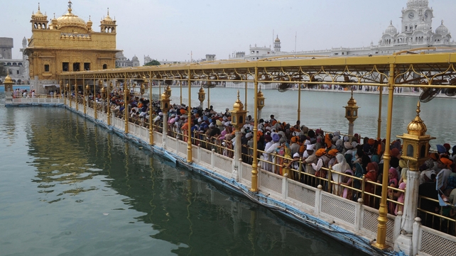 Indian Sikh devotees pay their respects at the Golden temple in Amritsar