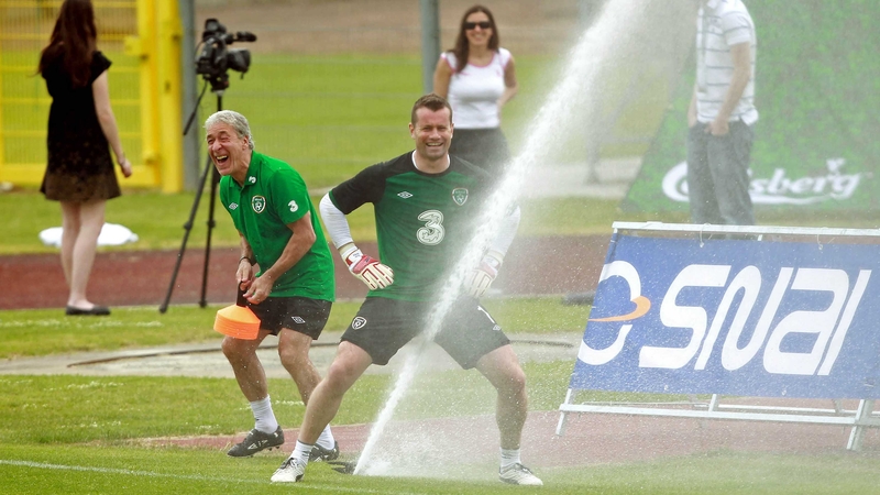 Shay Given and kit-man Mick Lawlor joke around with the pitch side water sprinkler at training today