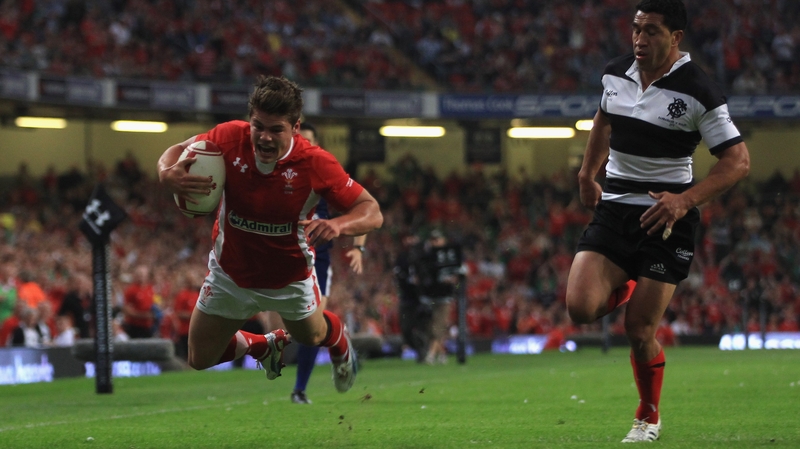 Harry Robinson of Wales crosses the line to score the opening try