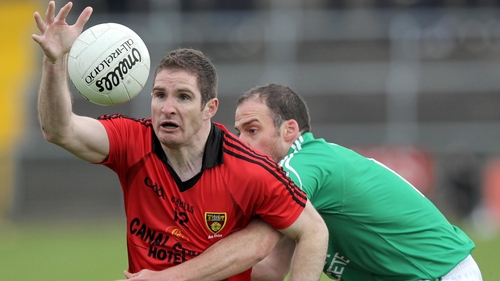 Fermanagh's Brian Og Maguire with Down's Aidan Carr