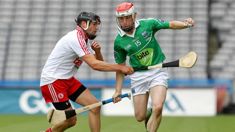 Tyrone's Paul McGoldrick battles with Fermanagh's Mike O'Gorman