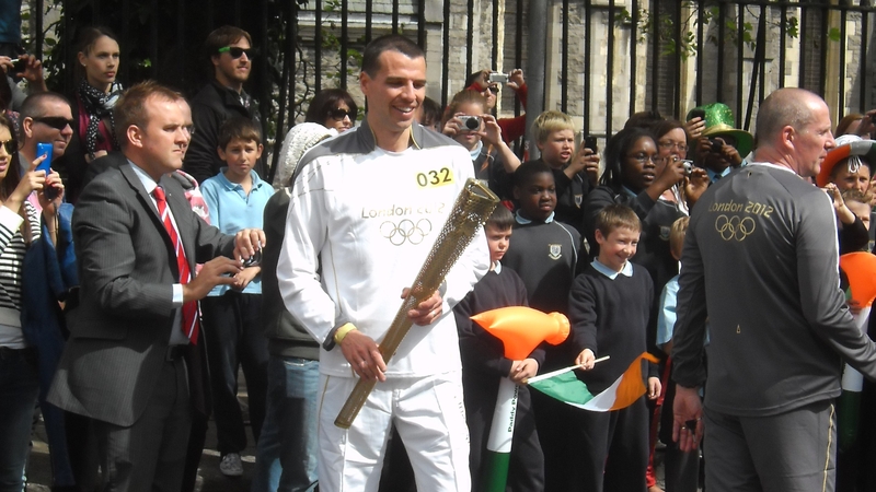 Mark Kenneally with the Olympic torch