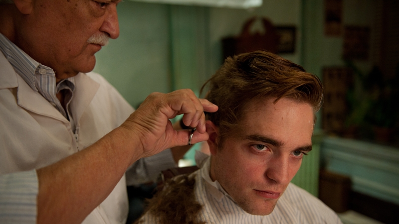 The only moment of feeling seeps through in Eric Packer's visit back to his old childhood barber