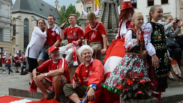 Ukrainian girls pose with Danish fans in Lviv at the Euro 2012 football championships