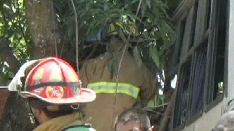 Fire crews attempt to rescue children from bus