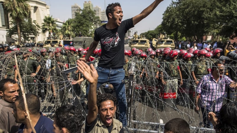 A protester outside the Supreme Constitutional Court