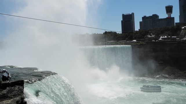 A tourist ship in Niagara Falls passes under the tight rope which will be used by Nik Wallenda to cross from the US to Canada