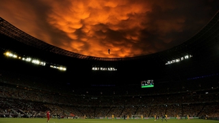 The match re-started under menacing looking skies