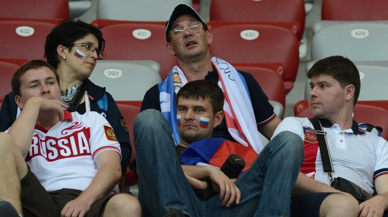 Russian fans after the game can hardly believe they are going home early