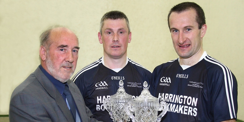 Barry Goff and Colin Keeling receive their trophies after securing back-to-back victories in the Men's Open Nationals