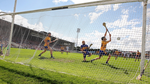 Waterford's Eoin Kelly crashes a penalty into the Clare net