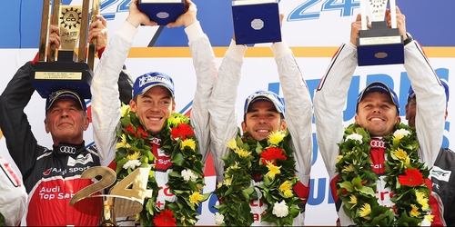 The Audi Sport Team of Andre Lotterer, Benoit Treluyer and Marcel Fassler celebrate with Head of Audi Sport Dr Wolfgang Ullrich (l)