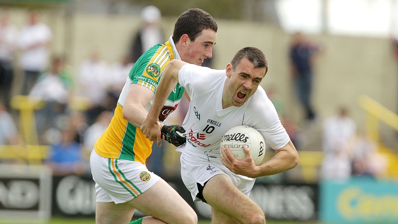Offaly's Eoin Rigney with John Doyle of Kildare